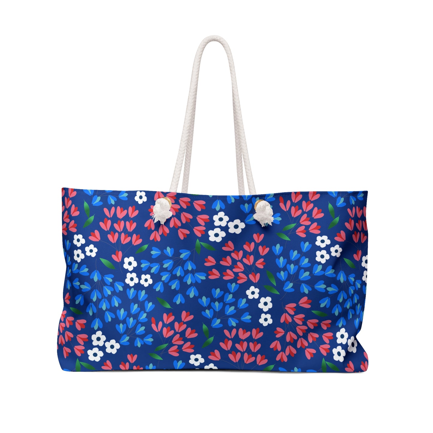 Weekender Bag featuring deep-blue fabric with red, light-blue, and white floral print, complemented by thick white rope handles. Ideal for stylish travel, reflecting FireBrook Essentials' commitment to joyful, practical design.