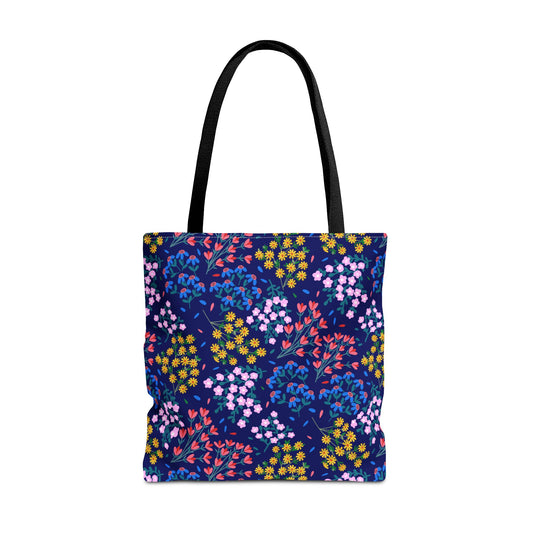 Midnight Garden Tote Bag features a deep navy body with vibrant floral patterns. Black shoulder straps and structured design offer durability and style, embodying FireBrook Designs' commitment to joyful, practical fashion.