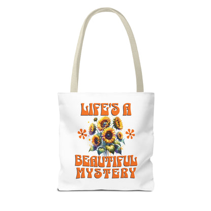 Life's A Beautiful Mystery Tote Bag with orange text and floral design, featuring durable polyester and reinforced handles, ideal for everyday adventures.