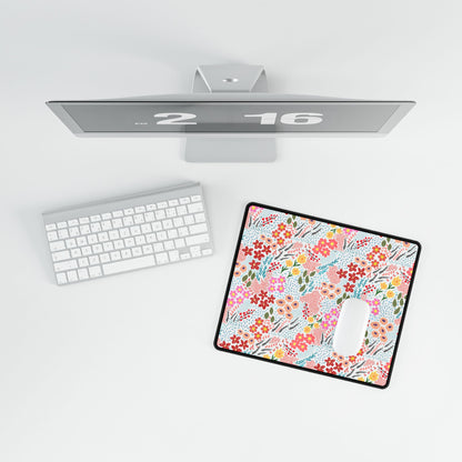Bird’s-eye view of a minimalist desk featuring the Desk Mat - Garden Floral Pattern with vibrant blossoms, enhancing workspace elegance. A white keyboard and mouse complete the stylish setup.