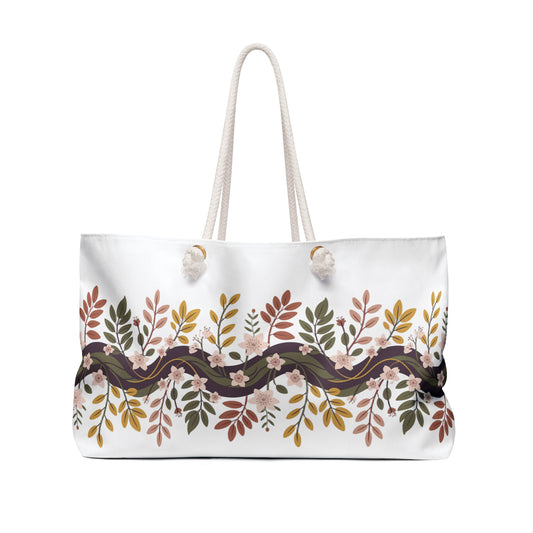 Botanical Weekender Bag with a whimsical design of flowers and leaves, featuring durable rope handles and a generous size for essentials, perfect for joyful, stylish getaways.