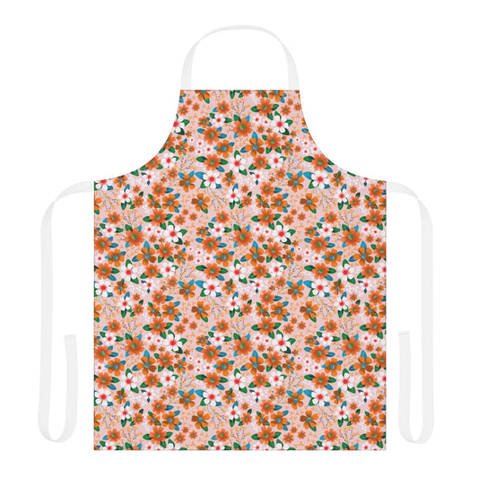Floral Apron: A full-coverage kitchen apron featuring a soft pink backdrop adorned with orange and white flowers, accented by green leaves. Equipped with white neck and waist ties for a comfortable fit.