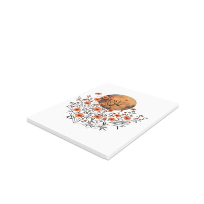 Moon Greeting Cards — Pack of 8/16/24 features delicate orange blossoms and foliage around an amber-toned moon, showcasing vibrant full-color printing. Each card includes a matching white envelope.