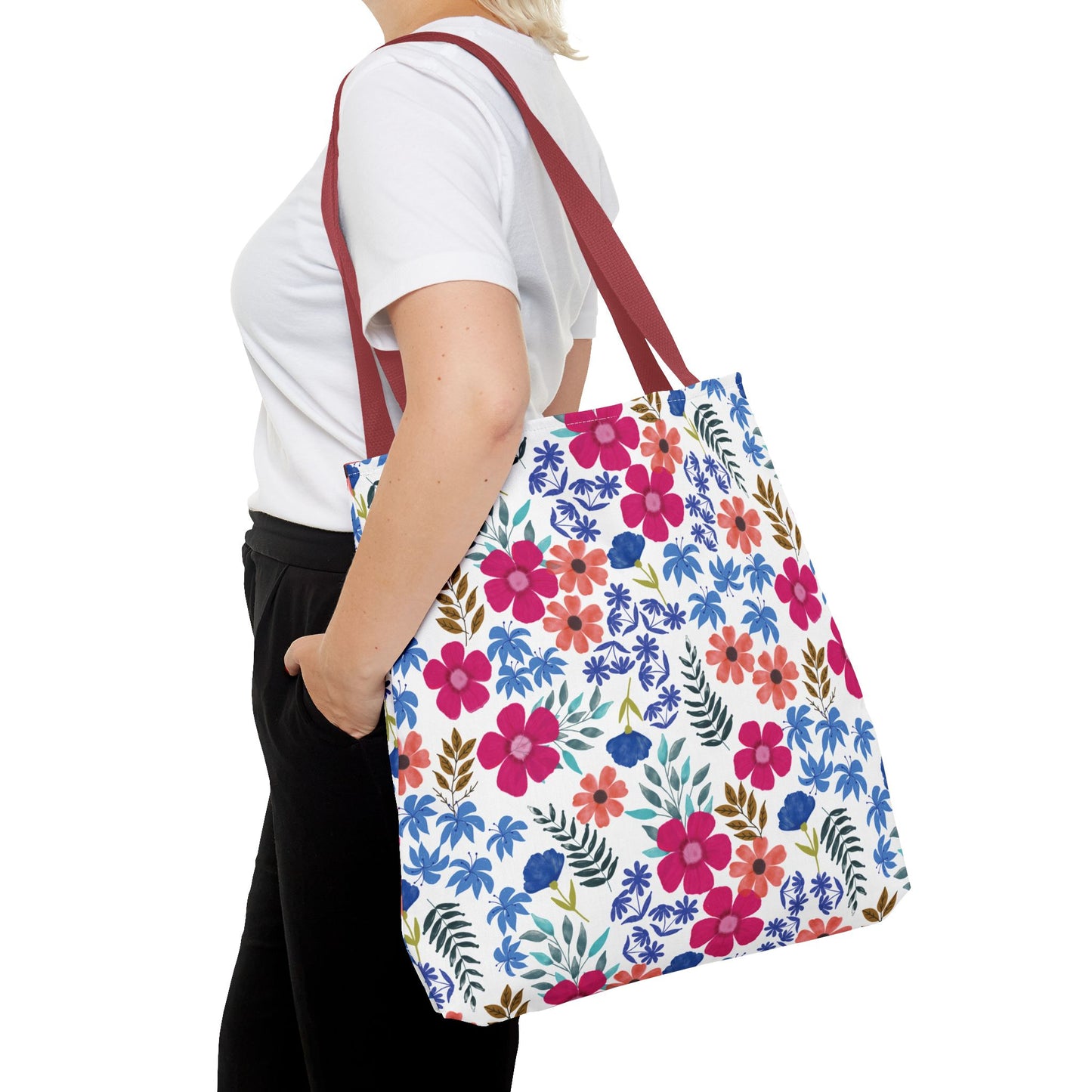Confetti Wildflower Tote Bag with vibrant floral pattern and burgundy straps, carried by a person in casual attire, reflecting FireBrook Essentials' joyful, stylish design for versatile summer use.