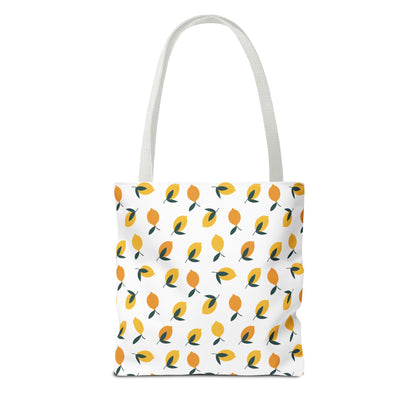 Lemon Tote Bag - Fresh and Fun Citrus Pattern: A white canvas tote adorned with a vibrant, repeating lemon motif, featuring stylized lemons and green leaves, ideal for brightening any summer outing.