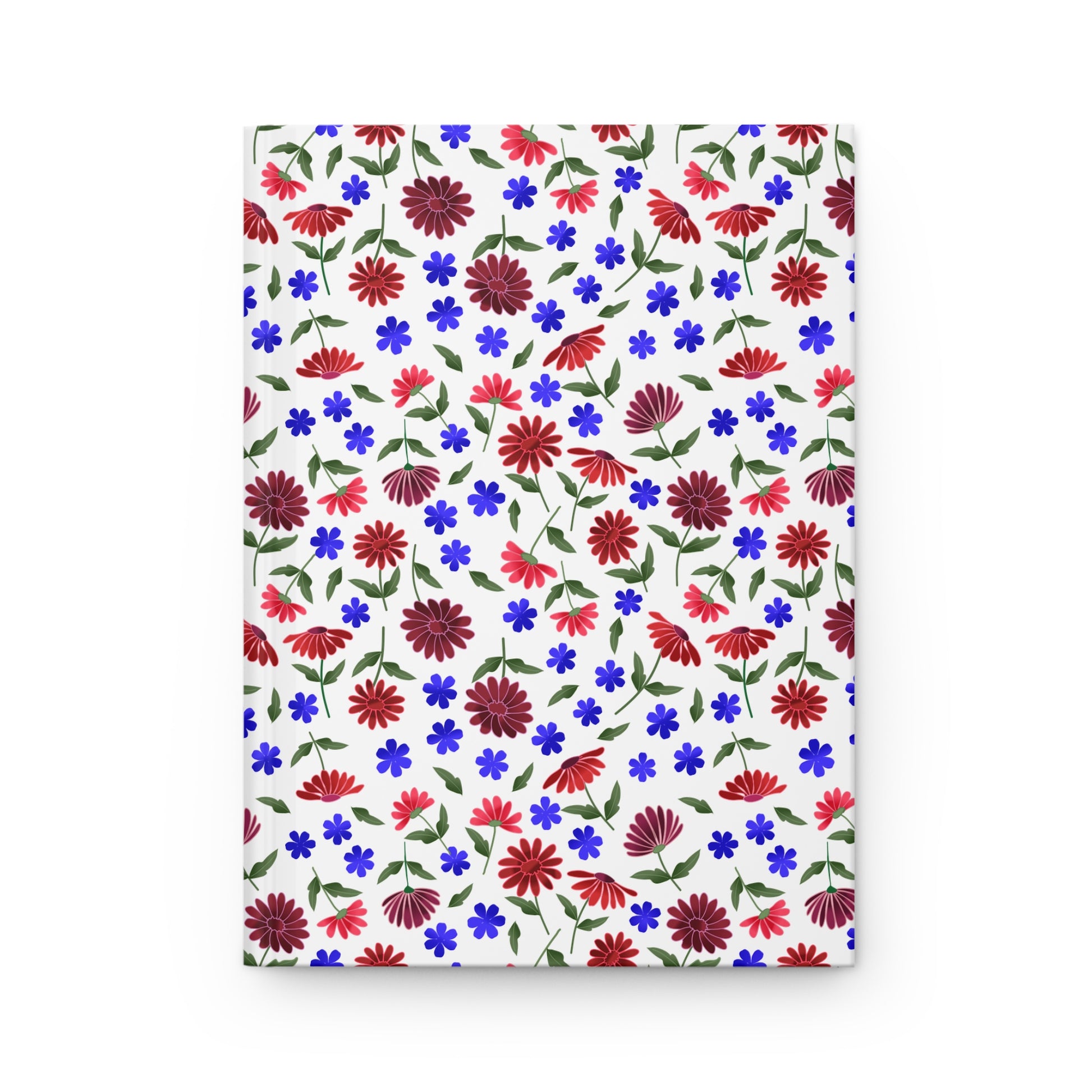 Floral Ditsy Hardcover Journal — Red & Blue Wildflower Notebook features a seamless floral pattern with red daisies and blue flowers on a white cover, embodying FireBrook Essentials' joyful, uplifting design ethos.