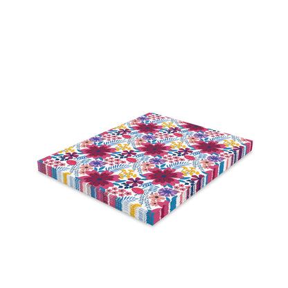 Floral Wildflower Greeting Cards — Pack of 8/16/24 feature a vibrant stack of decorative paper napkins with multicolored floral patterns, showcasing large blossoms and smaller flowers, embodying FireBrook Designs' joyful, uplifting aesthetic.