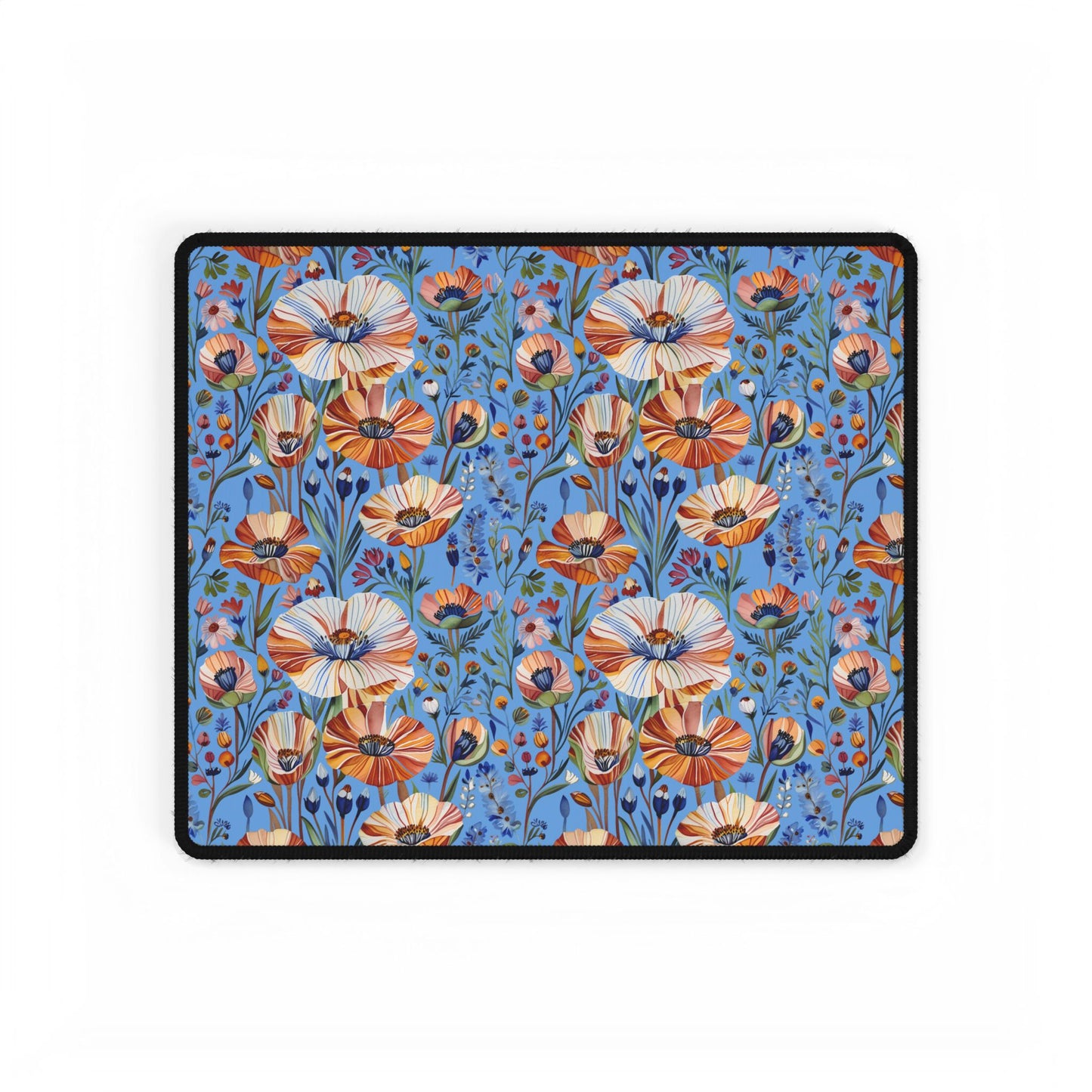 Desk Mats - Spring Wildflowers Poppy Cornflower Iris Design features a vibrant wildflower pattern with orange, cream, and pink blooms on a blue background, bordered in black, ideal for enhancing any workspace.