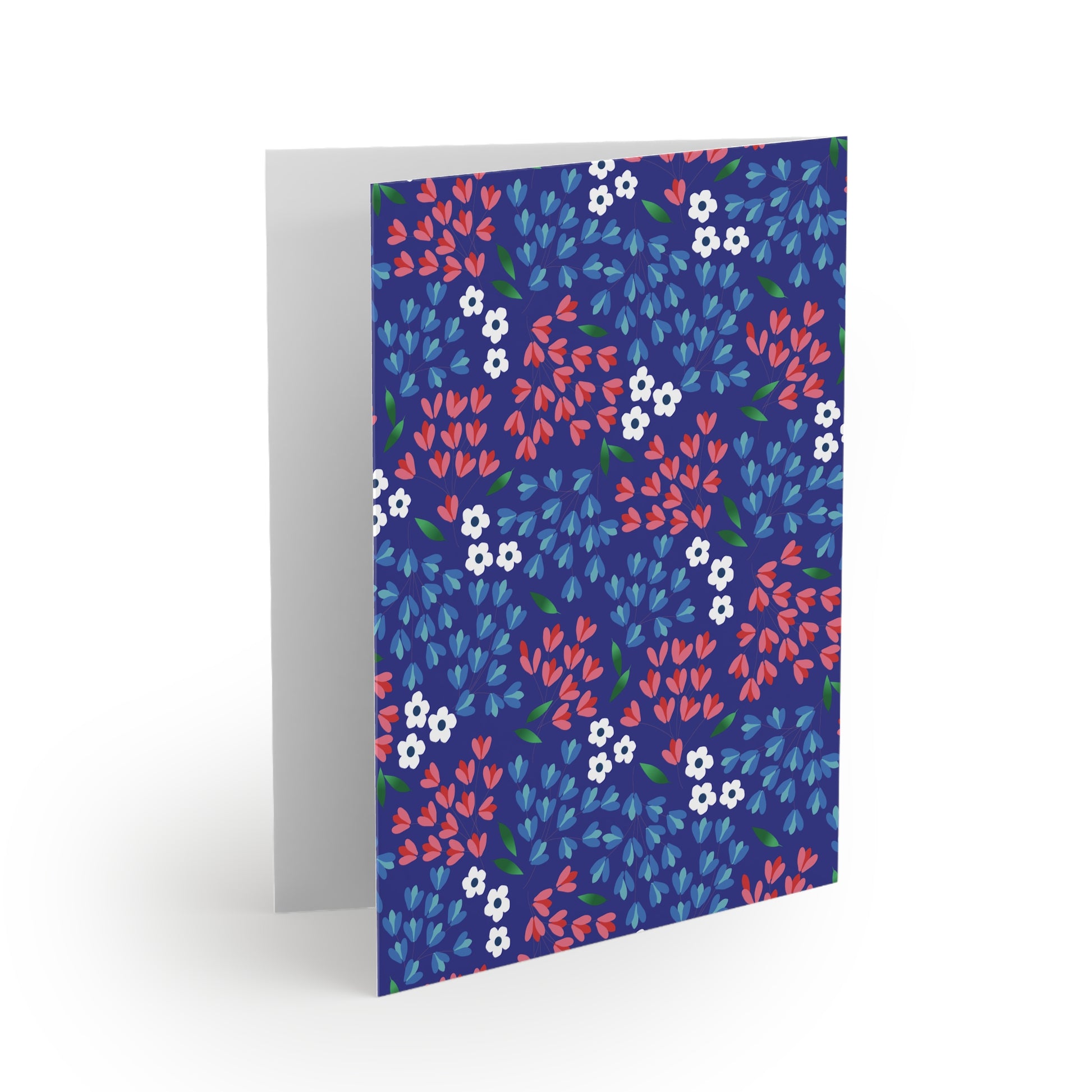 Floral Wildflower Greeting Cards — Pack of 8/16/24 feature a navy-blue cover with vibrant floral patterns, including red and light blue petal leaves, white flowers, and green accents, perfect for heartfelt messages.
