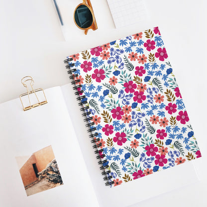 Floral Spiral Notebook with vibrant watercolor-style floral cover, accompanied by round-lens sunglasses and open book, showcasing FireBrook Essentials' blend of style and functionality for creative, joyful living.