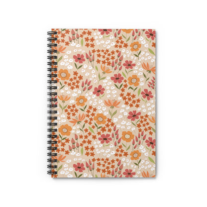Floral Spiral Notebook with vibrant orange, rust-red, and white blossoms on a beige cover, featuring a sleek metal spiral binding, ideal for creative and organized note-taking from FireBrook Designs.
