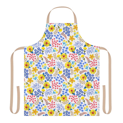 Apron Floral Design features a vibrant floral print with yellow, blue, and pink flowers, complemented by tan ties. Made from soft, stain-free polyester canvas, perfect for cooking or crafting.