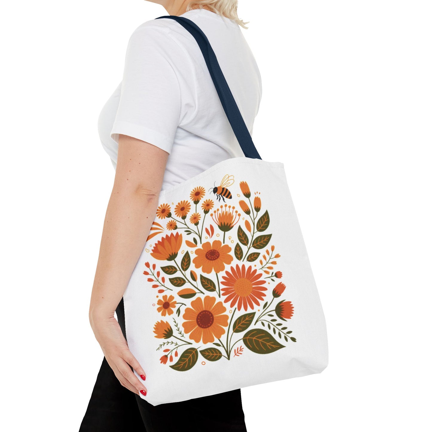 Folk Floral Tote Bag showcasing hand-drawn wildflowers in warm hues on a white background, perfect for nature lovers. Ideal for everyday use, this bag combines style and practicality, offered by FireBrook Essentials.