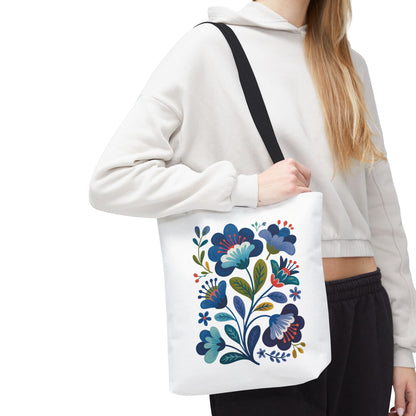 Vintage Folk Art Design Blue Floral Tote Bag featuring a charming, nostalgic blue floral pattern. Ideal for everyday use or special occasions, it embodies unique style with reinforced handles and a durable polyester body.