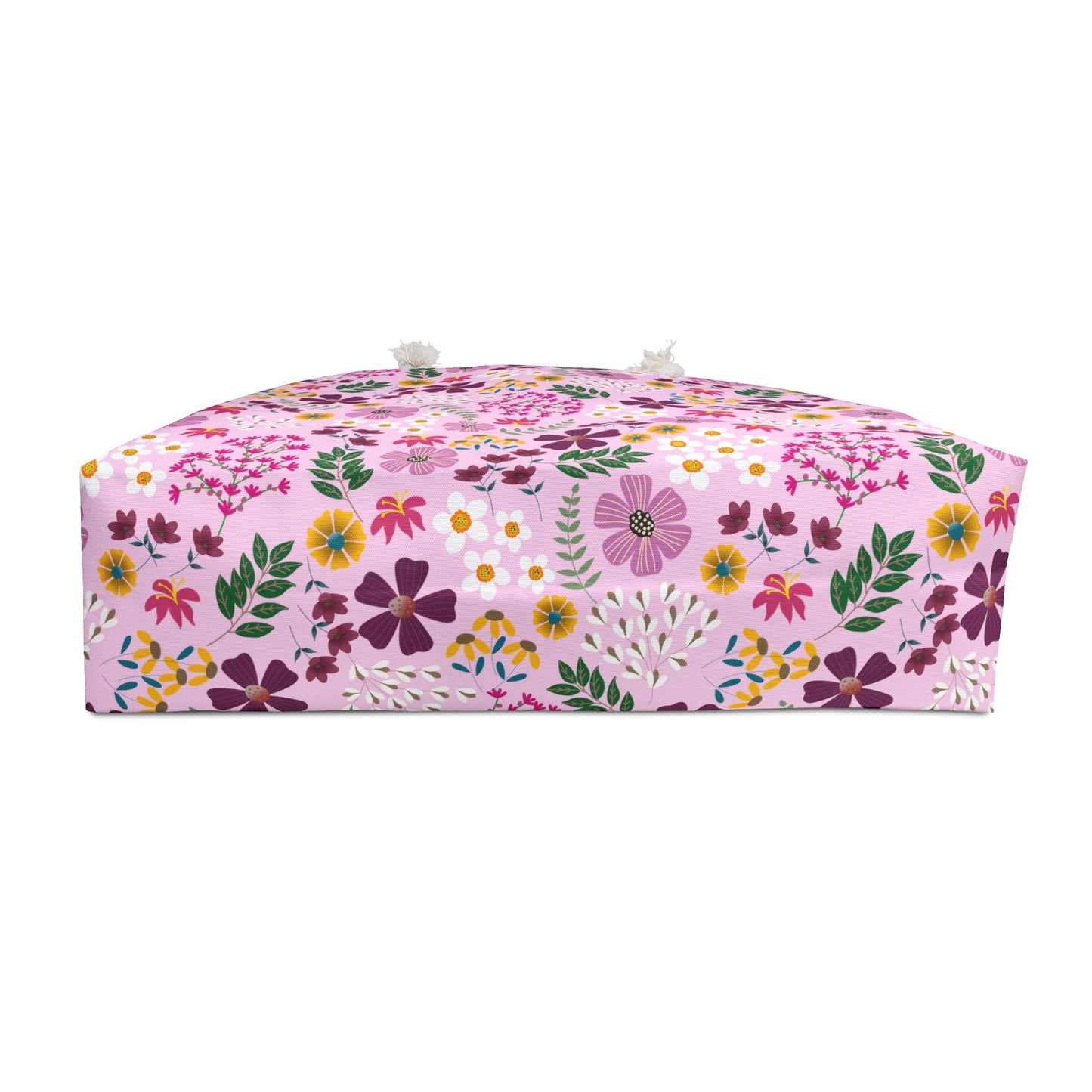 The Weekender Bag showcases a vibrant red bouquet design, featuring rope handles and a cream interior. Perfect for stylish travel, embodying FireBrook Essentials' commitment to joyful, uplifting design.