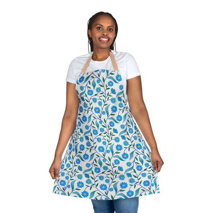 Person in a white tee models the Apron Floral Design, showcasing its blue daisy pattern. This stain-free, polyester canvas apron offers comfort and style, perfect for cooking or crafting.
