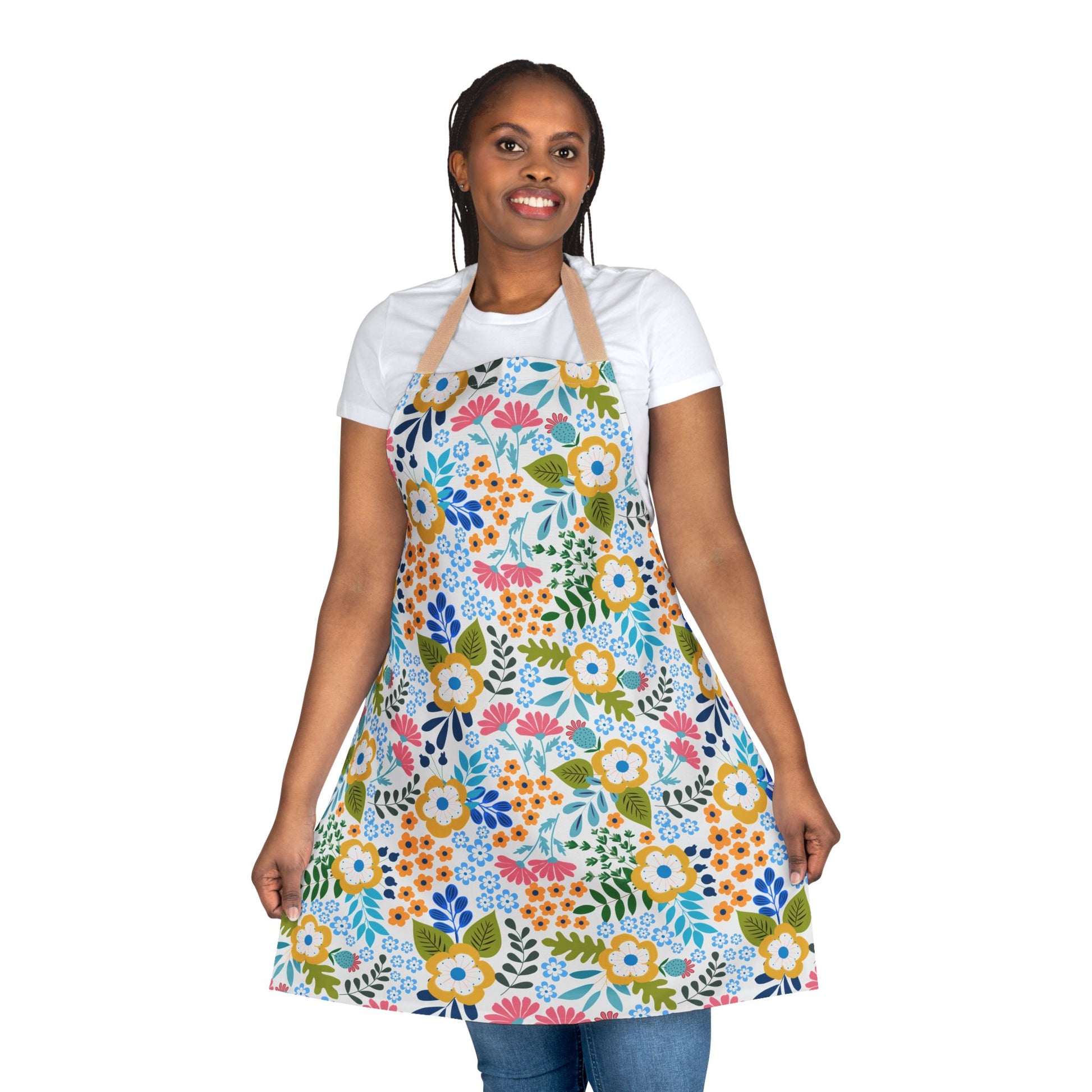 Smiling woman models the vibrant Floral Apron with a colorful floral pattern, offering stain-free protection. Made of soft, comfortable polyester canvas, perfect for joyful cooking or crafting.