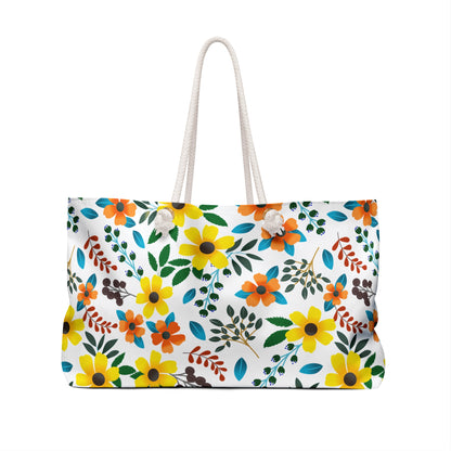 Weekender Bag with bright floral pattern and twisted rope handles, perfect for stylish travels or beach days. Spacious design with luxurious interior, ideal for joyful getaways and vacations.