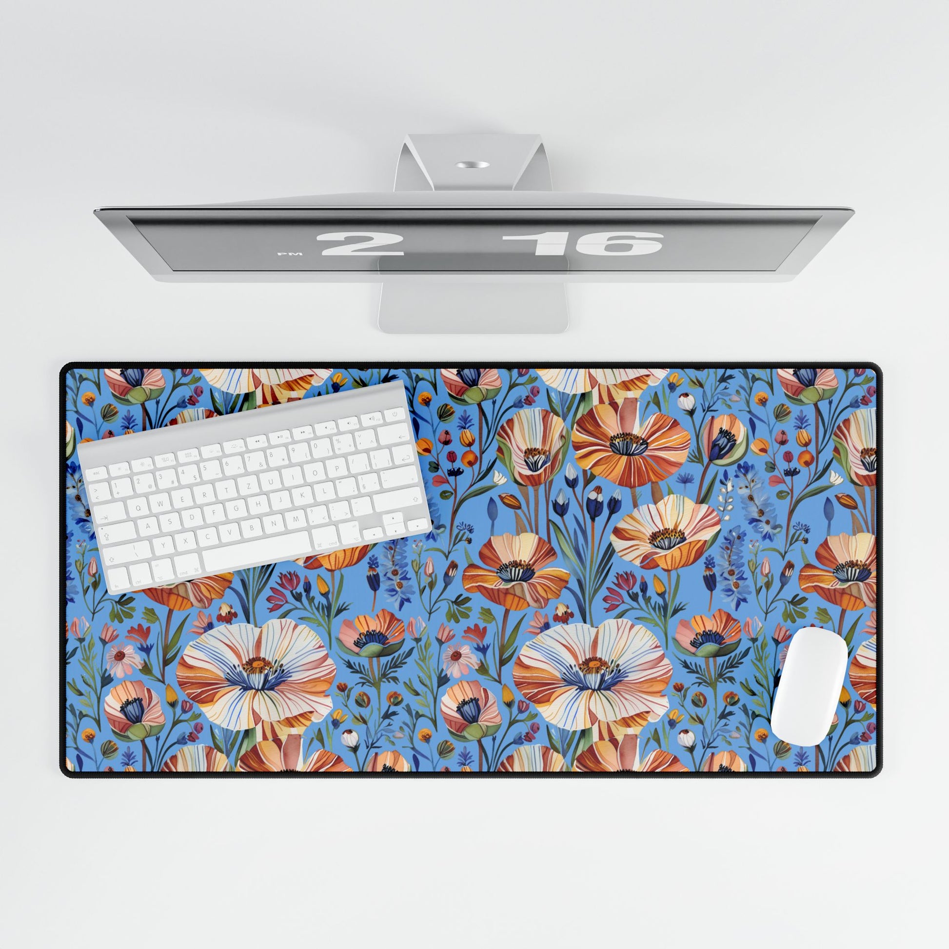 Desk Mats - Spring Wildflowers Poppy Cornflower Iris Design features a vibrant blue pad with orange, cream, and rust-toned flowers, enhancing your workspace with nature-inspired elegance, topped by a sleek white keyboard and mouse.