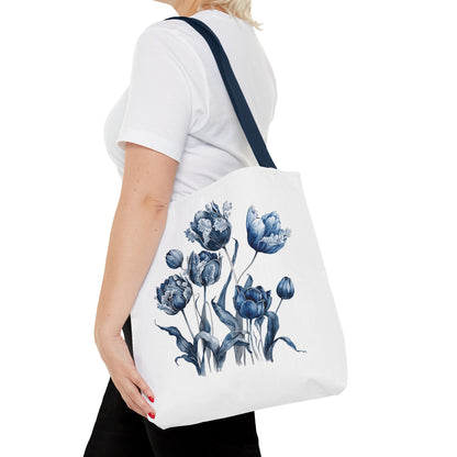 Woman carrying Flowers in Blue Hue Watercolor Tote Bag, showcasing blue floral design, ideal for stylish, durable daily use.