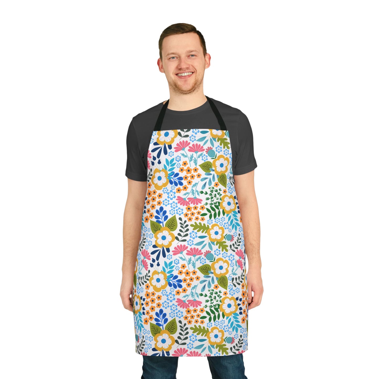 Man wearing a Floral Apron, featuring a vibrant multicolored floral design, showcasing its full-coverage and comfortable fit with a black neck strap from FireBrook Designs' joyful, practical apparel collection.