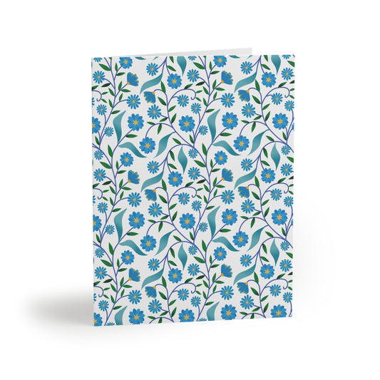 Floral Greeting Cards — Pack of 8/16/24 featuring a stylized botanical pattern with blue daisies and teal leaves, perfect for cheerful messages. Matte finish, includes white envelopes. Designed for joyful connections.