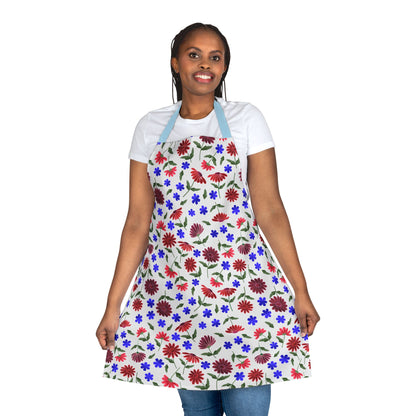 Person models the Floral Apron, featuring a colorful pattern and light-blue neck straps. Crafted from 100% polyester canvas, it offers a stain-free, comfortable fit, perfect for various activities.