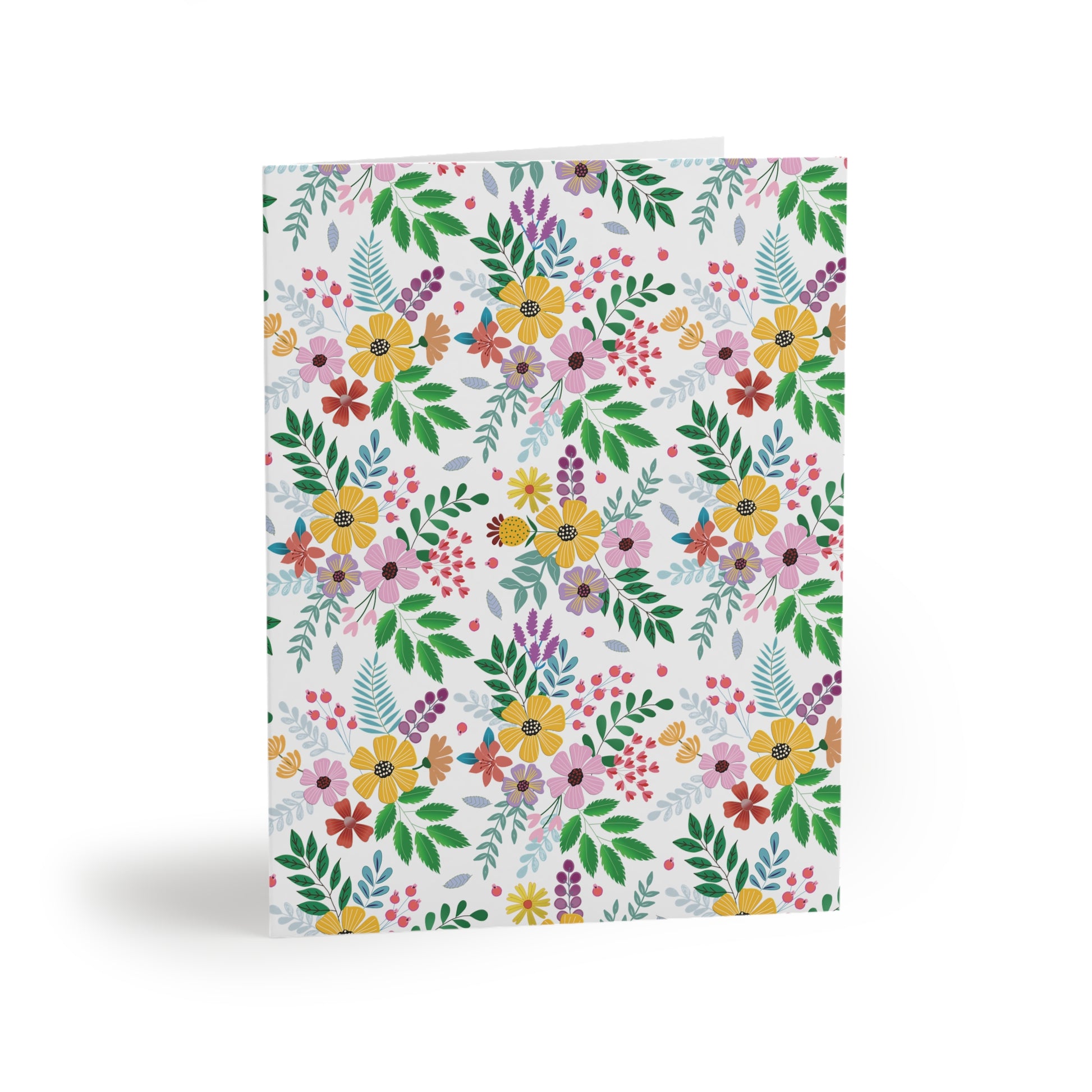 Floral Greeting Cards — Pack of 8/16/24 featuring a vibrant, hand-drawn wildflower pattern on a crisp white background, embodying cheerful, springtime energy. Each card includes a matching white envelope, perfect for personal messages.