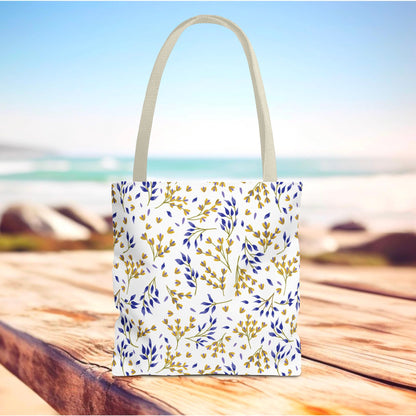 Floral Tote Bag with tan handles, featuring a vibrant deep blue and mustard yellow botanical pattern, perfect for summer outings. Its durable polyester body and reinforced stitching provide strength and style.