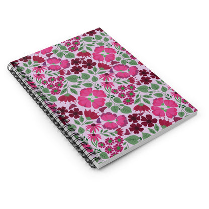 Floral Spiral Notebook with a pink background features vibrant floral patterns and a sleek black wire binding, embodying the joyful, uplifting designs of FireBrook Essentials. Perfect for creative note-taking and sketching.