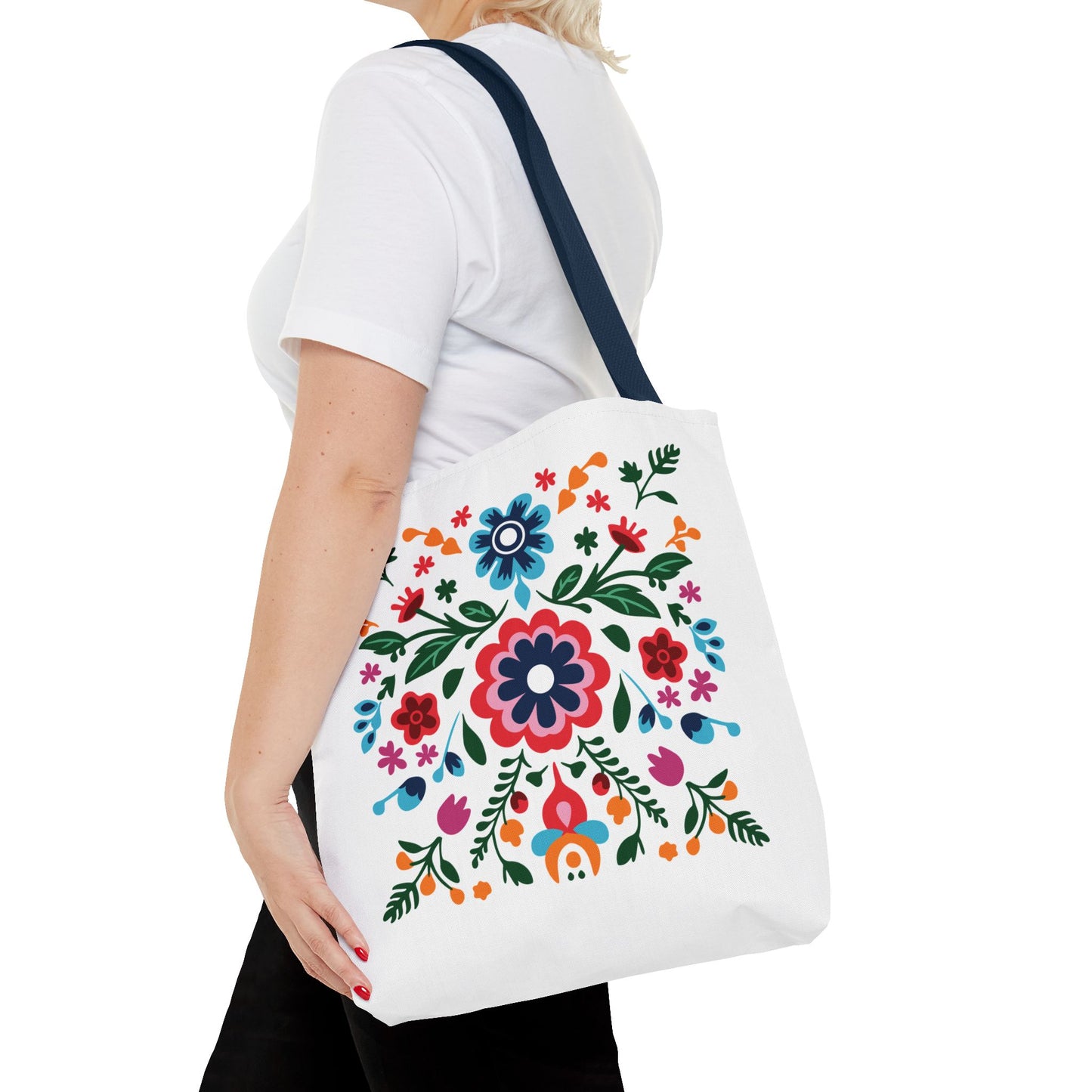 Woman holding a Floral Tote Bag with colorful flower design, showcasing its stylish and durable nature, ideal for everyday use.