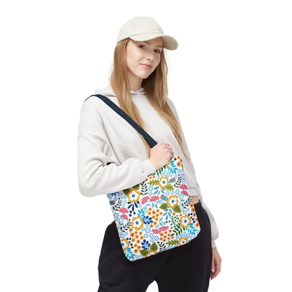 Floral Tote Bag carried by a young person in a light hoodie and beige cap, featuring vibrant stylized flowers and navy straps, ideal for cheerful summer outings.