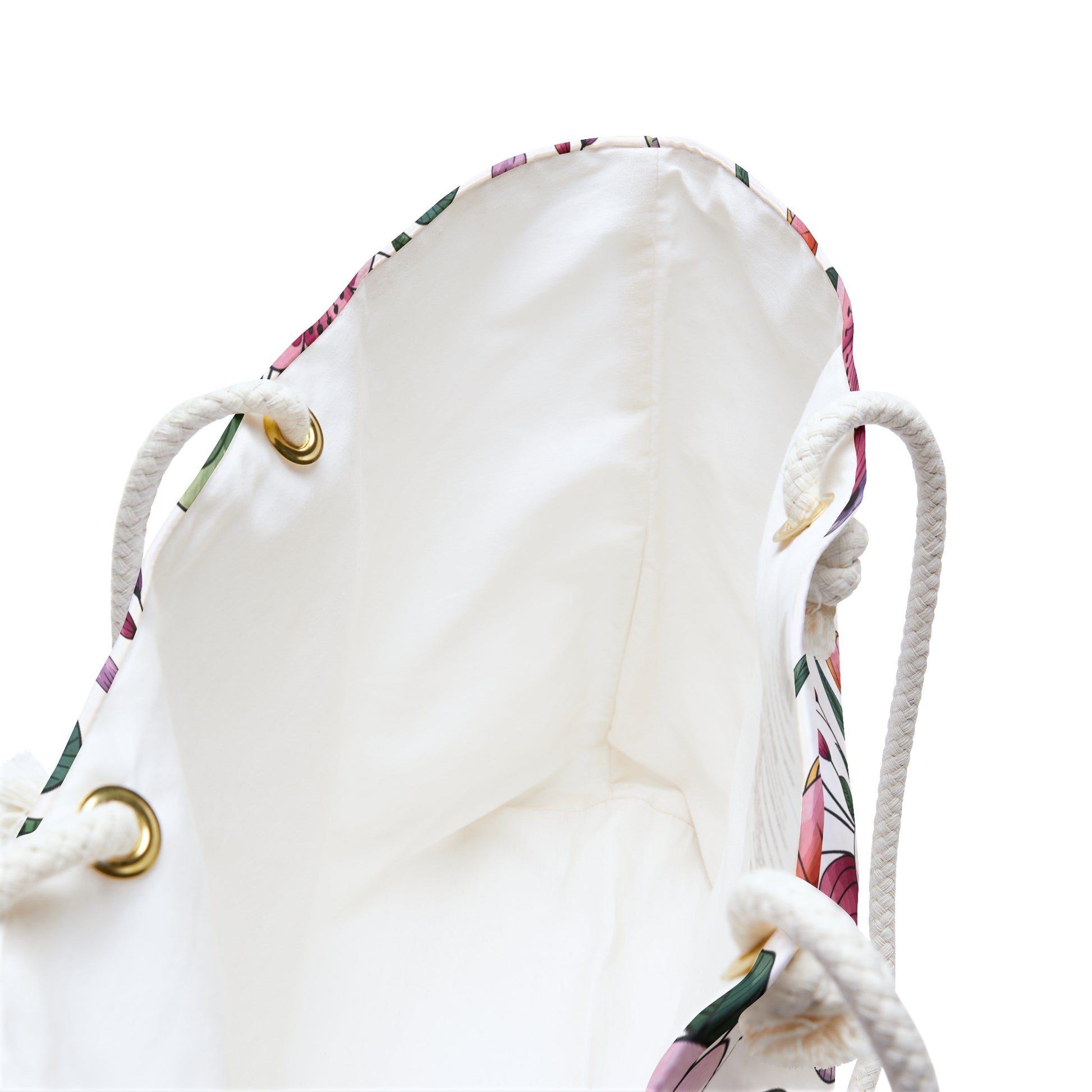 Botanical Weekender Bag with a playful floral and leaf pattern, featuring sturdy rope handles and metal grommets, ideal for whimsical travel, reflecting FireBrook Designs' commitment to joyful, stylish accessories.