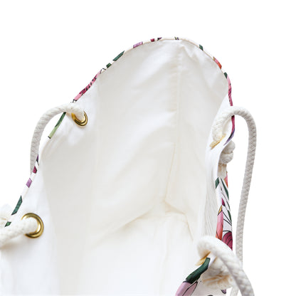 Botanical Weekender Bag with a playful floral and leaf pattern, featuring sturdy rope handles and metal grommets, ideal for whimsical travel, reflecting FireBrook Designs' commitment to joyful, stylish accessories.
