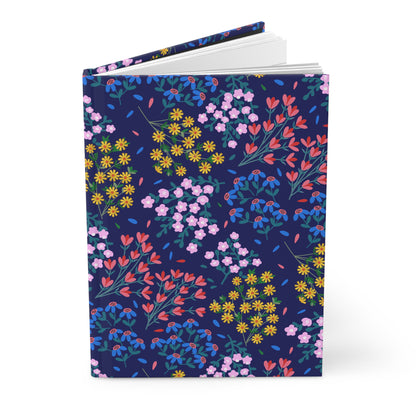 Floral Meadow Hardcover Journal — Navy Botanical Notebook for Notes & Gifts features a vibrant wildflower pattern on a matte navy cover, designed for joyful writing with 150 lined, perforated pages.