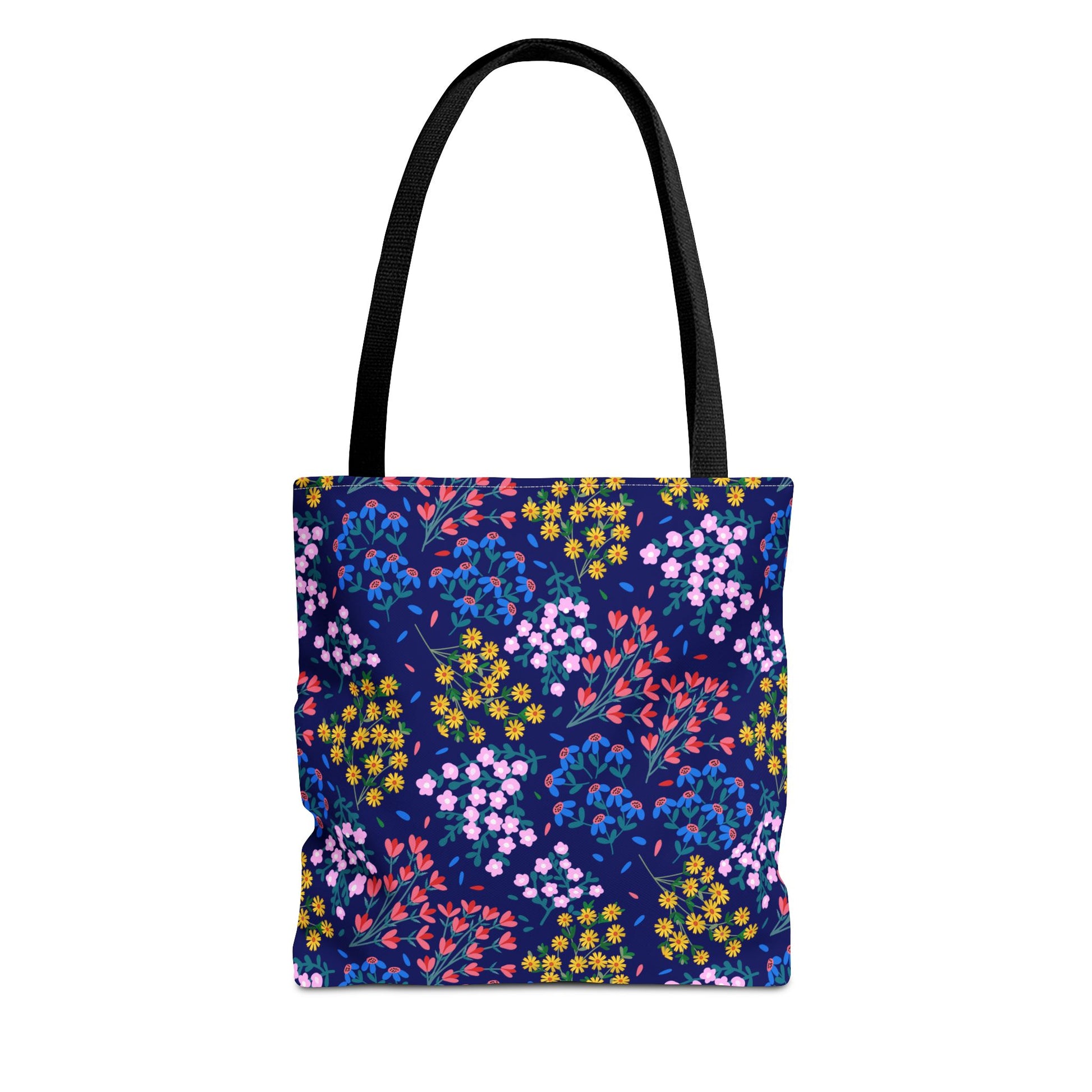 Midnight Garden Tote Bag features a dark navy-blue floral pattern with vibrant yellow, pink, red, and blue flowers. Equipped with sturdy black handles, it embodies FireBrook Designs' blend of style and practicality.