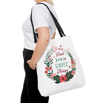 Find Joy in Simple Things Tote Bag with watercolor floral design, held by a woman, offering style and practicality for everyday use.