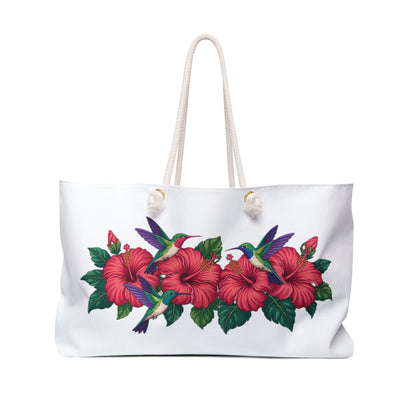 Tote Bag with hummingbirds and hibiscus design, showcasing vibrant patterns perfect for stylish travelers. Features rope handles, T-bottom for extra space, ideal for joyful weekend trips or summer getaways.