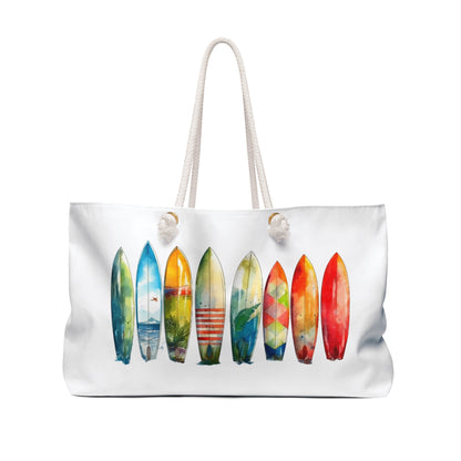 Weekender Bag featuring a surfboard print, designed with rope handles and gold grommets. Ideal for beach lovers, this spacious accessory embodies FireBrook Designs' uplifting and joyful essence.