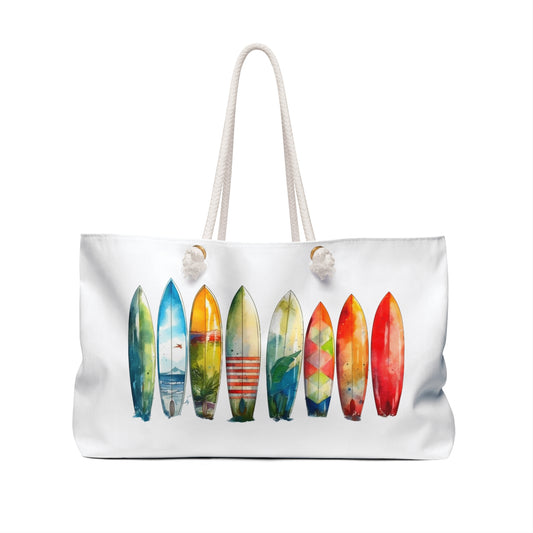 Weekender Bag featuring a surfboard print, designed with rope handles and gold grommets. Ideal for beach lovers, this spacious accessory embodies FireBrook Designs' uplifting and joyful essence.