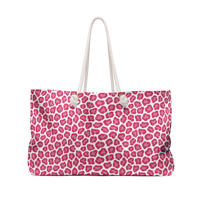 Cheetah Weekender Bag with pink and white leopard print, featuring durable polyester, cream rope handles, and a spacious T-bottom design, perfect for stylish travel by FireBrook Essentials.