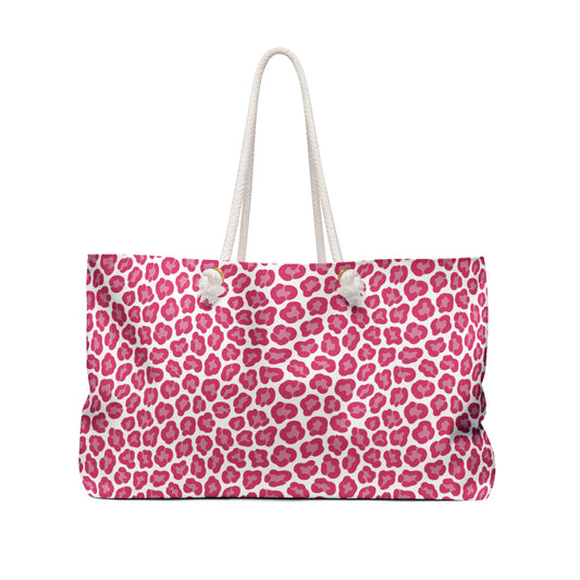 Cheetah Weekender Bag with pink and white leopard print, featuring durable polyester, cream rope handles, and a spacious T-bottom design, perfect for stylish travel by FireBrook Essentials.