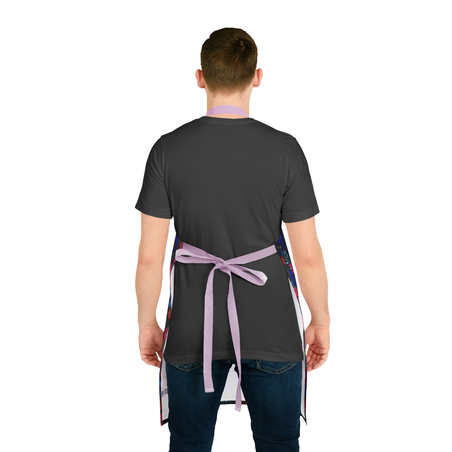 Person wearing the Apron Floral Design with light purple straps over a black t-shirt and blue jeans, showcasing its vibrant floral pattern and comfortable fit, embodying FireBrook Essentials' blend of style and functionality.