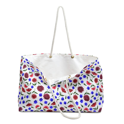 Floral Escape Weekender Bag — Red & Blue Wildflower Travel Tote features a vibrant floral pattern on a crisp white background, soft rope handles, and a structured T-bottom for stylish, cheerful adventures.