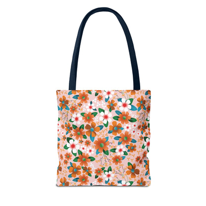 Floral Tote Bag with dark-blue handles, showcasing a cheerful orange and white floral pattern on pale pink. Ideal for summer outings, embodying the joyful and stylish spirit of FireBrook Designs.