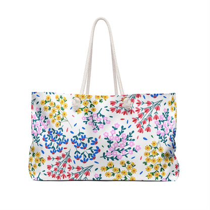 Weekender Bag with white rope handles and a vivid floral print, ideal for stylish travel. This spacious, wrinkle-resistant accessory from FireBrook Essentials combines practicality with joyful, uplifting design.