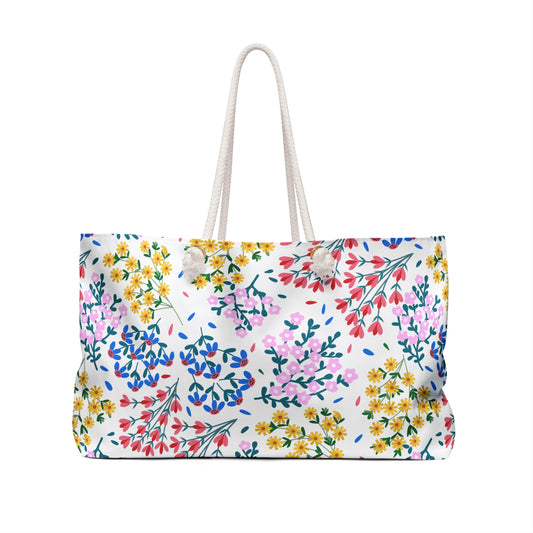 Weekender Bag with white rope handles and a vivid floral print, ideal for stylish travel. This spacious, wrinkle-resistant accessory from FireBrook Essentials combines practicality with joyful, uplifting design.