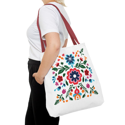 Woman holding a Floral Tote Bag with colorful flower design, showcasing FireBrook Essentials' blend of style and practicality.