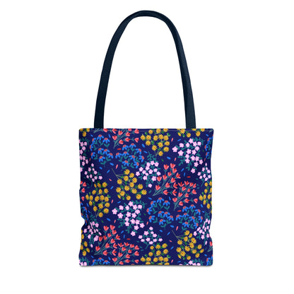 Midnight Garden Tote Bag featuring vibrant floral patterns on a deep blue canvas, with sturdy navy straps. Perfect for daily essentials, merging style and function, crafted by FireBrook Designs for joyful living.
