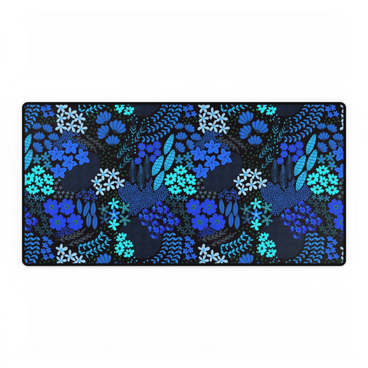 Blue Floral Desk Mat with a stitched black border, featuring hand-drawn florals and elements in blue and turquoise on a dark background, offering elegance and smooth mouse gliding for a joyful workspace.